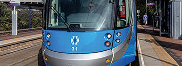 West Midlands Metro tram front on at tram stop