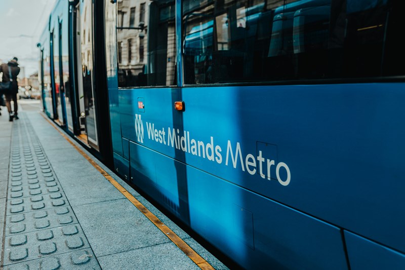 a close up of the West Midlands Metro logo on the tram