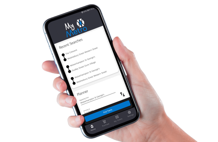 Hand holding phone showing My Metro app