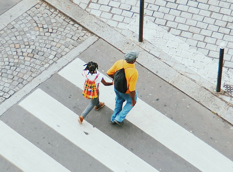 Pedestrians crossing the street safely